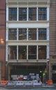 New York City, USA - Oct, 2018: New York building faÃÂ§ade under renovation/refurbishment. White windowless faÃÂ§ade and red brick