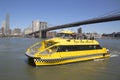 New York City Water Taxi under Brooklyn Bridge Royalty Free Stock Photo