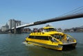 New York City Water Taxi under Brooklyn Bridge Royalty Free Stock Photo