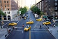 New York City yellow taxi cabs and pedestrians at an intersection Royalty Free Stock Photo