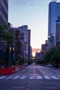 New York crowds and traffic at night. Empty road goes through Manhattan island near Time Square