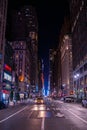 New York crowds and traffic at night. Empty road goes through Manhattan island near Time Square Royalty Free Stock Photo