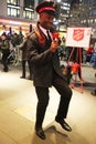 Salvation Army soldier performs for collections in midtown Manhattan. Royalty Free Stock Photo