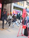 Salvation Army soldier performs for collections in midtown Manhattan. Royalty Free Stock Photo