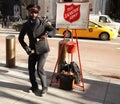 Salvation Army soldier performs for collections in midtown Manhattan during holidays season Royalty Free Stock Photo