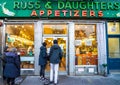 Tourists and locals stay in line outside of the famous Russ & Daughters appetizing store, opened in 1914 in Lower East Side Royalty Free Stock Photo