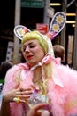 An expressive young woman wearing a rabbit-themed costume at the Fifth Avenue Easter Parade