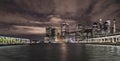 New York Financial District with skyscrapers and the river coast between two old Brooklyn piers before sunrise Royalty Free Stock Photo