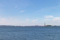 New York Harbor with the Statue of Liberty Background with a Clear Blue Sky in New York City Royalty Free Stock Photo