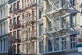 New York houses facades with fire escape stairs background Royalty Free Stock Photo