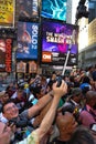 NEW YORK - JULY 26: Photographers, artists and crowd making photos at Times Square during first official Body Painting Event