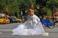 NEW YORK - June 13: Model Kalyn Hemphill crossing the street in front of Plaza hotel at the Irina Shabayeva SS 2016 Bridal shoot