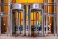 New York, Manhattan downtown. Revolving doors on glass building facade Royalty Free Stock Photo