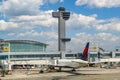 Air Traffic Control Tower and Delta Airlines plane on tarmac at Terminal 4 at JFK International Airport Royalty Free Stock Photo