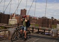 Bicyclist at the empty Brooklyn Bridge during the coronavirus COVID-19 pandemic lockdown in New York City Royalty Free Stock Photo