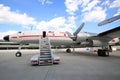 TWA Hotel`s 1958 Lockheed Constellation airplane in front of the landmark TWA Flight Center building designed by Eero Saarinen