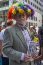 New York, New York: A dapper gentleman wearing a hat with flowers and feathers
