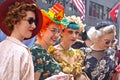 A group of young women wearing colorful, creative costumes at the Fifth Avenue Easter Parade