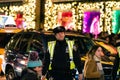 New York, New York - 12/24/2018 : NYPD police officer in Manhattan while the city is lit up during Christmas time Royalty Free Stock Photo
