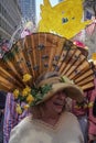 New York, New York: A smiling woman wears an elaborate Easter bonnet with a large fan