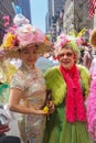 New York, New York: Two Asian women wearing colorful Easter outfits