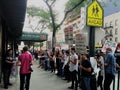 People outside B&H Photo store in Manhattan protesting with signs calling for termination of union-busting in the hands