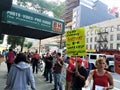 People outside B&H Photo store in Manhattan protesting with signs calling for termination of union-busting in the hands