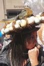 Woman wearing a bonnet featuring a lizard and its eggs at the Fifth Avenue Easter Parade