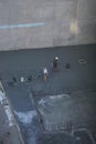 New York, New York: Workers use machines to smooth the surface of newly-poured cement