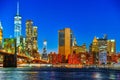 New York night view of the Lower Manhattan and the Brooklyn Bridge across the East River. Royalty Free Stock Photo