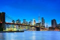 New York night view of the Lower Manhattan and the Brooklyn Bridge across the East River. Royalty Free Stock Photo