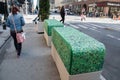 Concrete Street security barricades along Seventh Avenue in Manhattan, New York City that have a vinyl cover that makes it look
