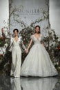 Designer Madeline Gardner and model walk the runway during the Morilee by Madeline Gardner Spring 2020 bridal fashion show