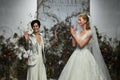 Designer Madeline Gardner and model walk the runway during the Morilee by Madeline Gardner Spring 2020 bridal fashion show