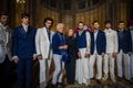 Designer Reem Acra, Joseph Abboud and male models pose on the runway during the Reem Acra Bridal Spring 2020 fashion collection
