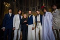 Designer Reem Acra and male models pose on the runway during the Reem Acra Bridal Spring 2020 fashion collection