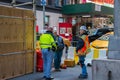 New York, NY - April 3, 2019: Group of three construction workers in reflective vests and hard hats at a construction site on a Royalty Free Stock Photo