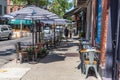 New York, NY - AUGUST 26 2020: A fashionable sidewalk cafe with striped umbrellas Royalty Free Stock Photo