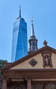 Behind St Paul`s Chapel 1766 in Lower Manhattan, NYC is One World Trade Center or Freedom Tower 2014 Royalty Free Stock Photo