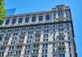 Looking up at the Gothic-inspired Trinity Building 1905, adjacent to the churchyard of Trinity Church on Broadway in Lower