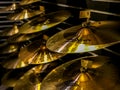 A row of drum cymbals on display.