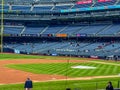 Yankee Stadium bleachers with a few spectators.