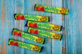 Mamba Sour candy with mix flavor in package on old wooden background