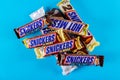 snickers chocolate bar isolated on blue background maple almond butter candy ang almond butter candy bar