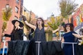 Group of cute and scary witches at NYC Village Halloween parade