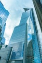 New York, NY /United States - Mar. 22, 2019: A vertical view of 30 Hudson Yards with reflections of clouds on its surface Royalty Free Stock Photo
