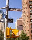 Vertical daytime image of the iconic Amsterdam Avenue street sign in New York CityÃ¢â¬â¢s upper