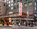 Tourist waiting to enter the iconic Katz\'s Delicatessen, also known as Katz\'s of New York City