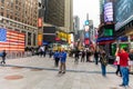 Tourists in Times Square on a Cloudy Morning