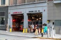 Fire Engine lights flash in FDNY NYC Fire Station doors open onlookers Royalty Free Stock Photo